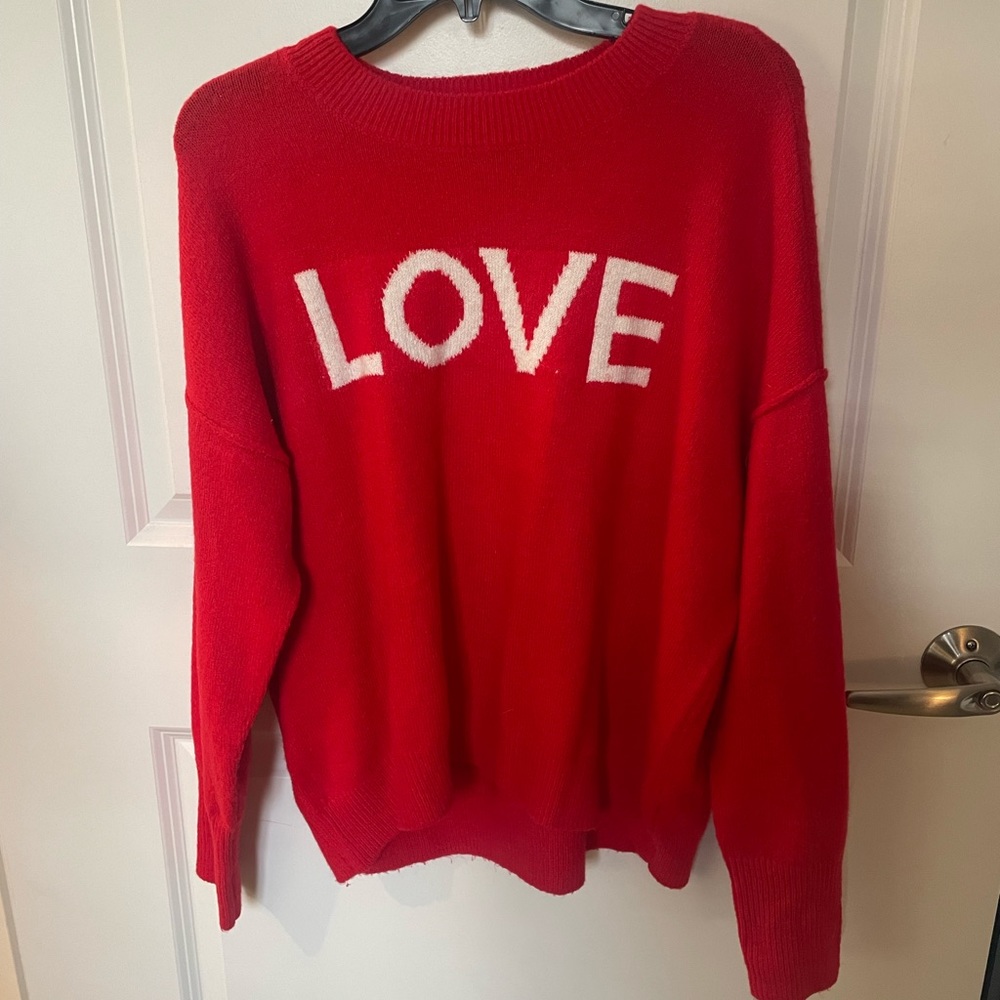 “Love” sweater sold my Sams brand is Vince camuto. Size is small , worn once .